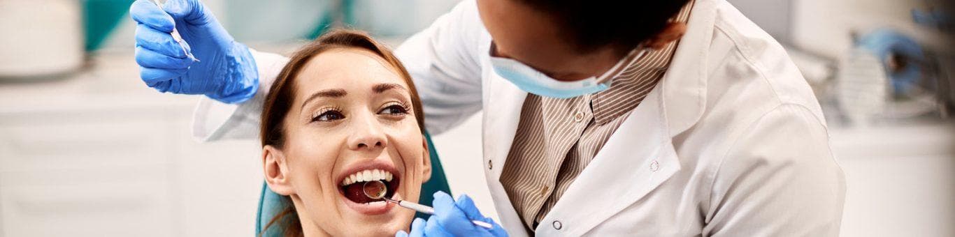 A woman getting a dental examination.