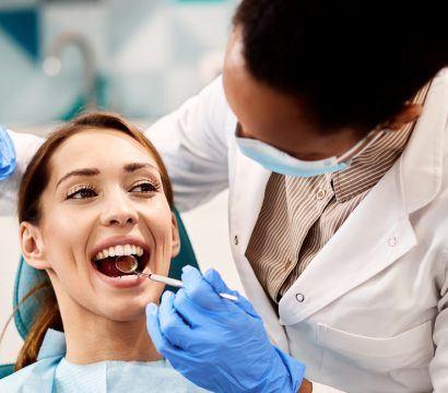 A woman getting a dental examination.