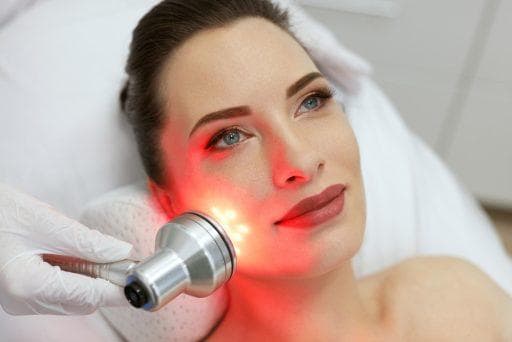 Beautiful woman enjoying light therapy.