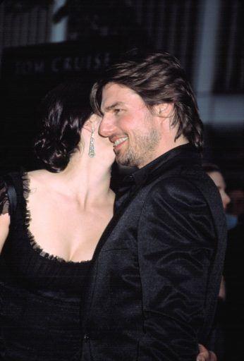 Tom Cruise with woman wearing black.